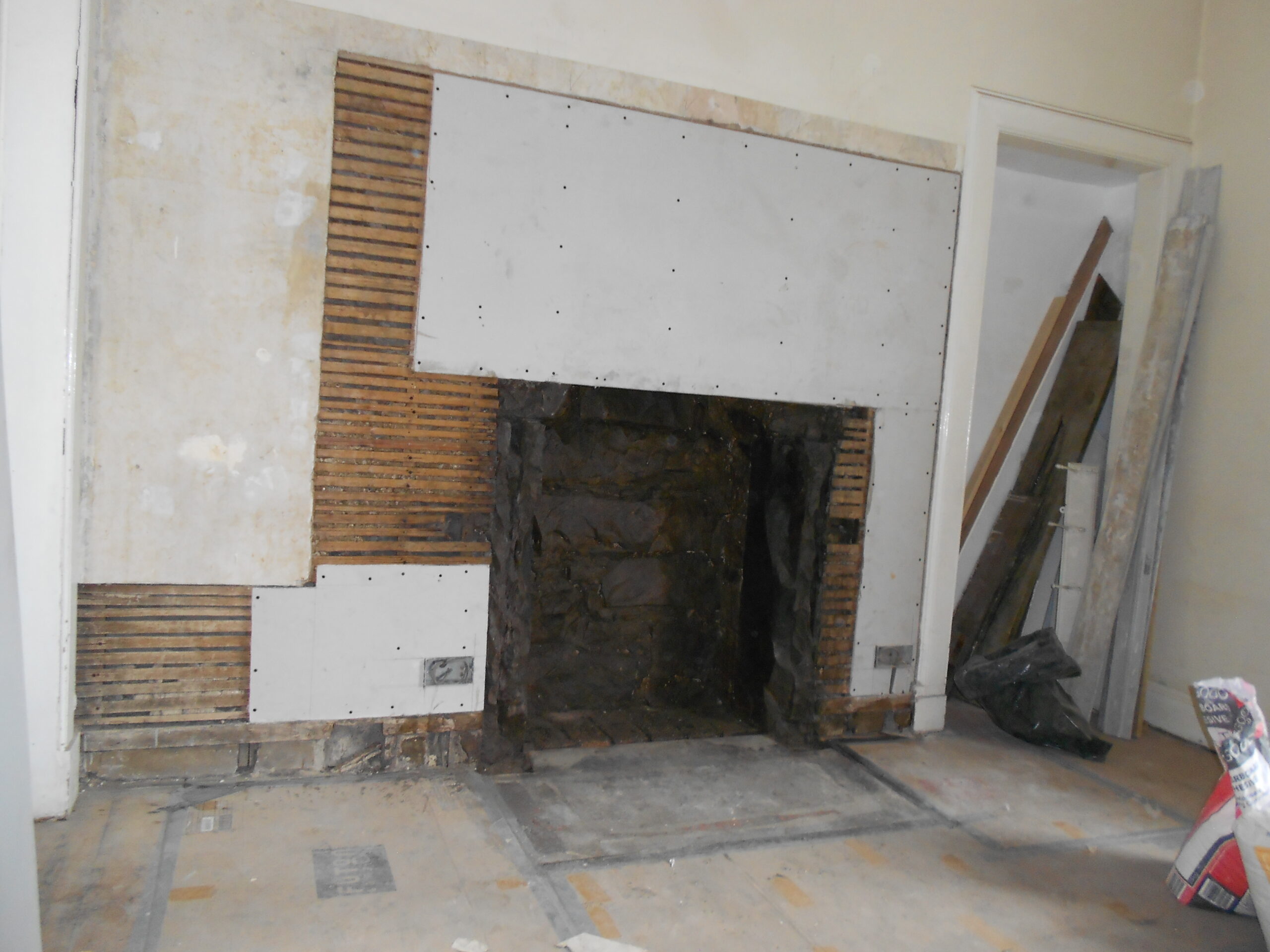 fireplace removal plastered badly with boards