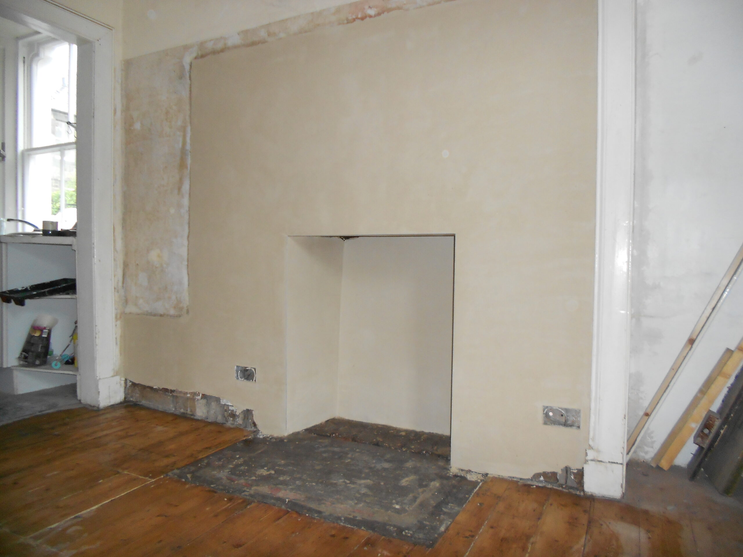 fireplace removal after shot with fully plastered smooth wall