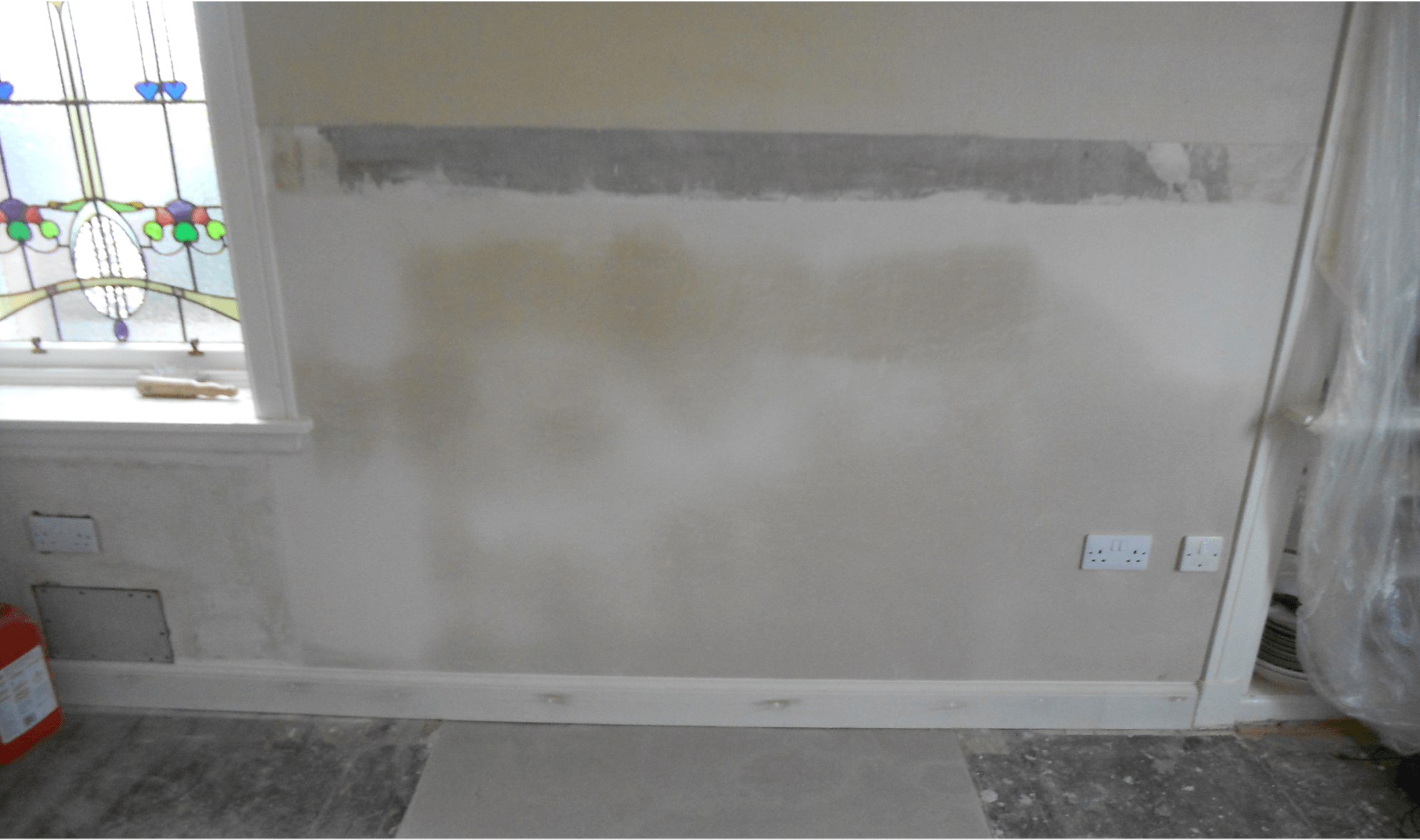 fireplace removed with new plastering and skirting added